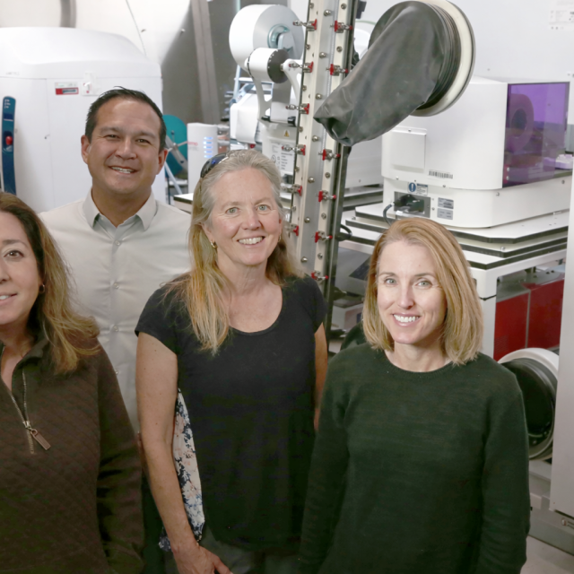 UC Santa Barbara collaborators (left to right) Michelle O’Malley, Ty Vernon, Jean Carlson, and Elaine Kirschke stand in the NSF ExFAB Biofoundry, a state-of-the- art facility central to the university’s newly awarded project.