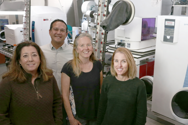 UC Santa Barbara collaborators (left to right) Michelle O’Malley, Ty Vernon, Jean Carlson, and Elaine Kirschke stand in the NSF ExFAB Biofoundry, a state-of-the- art facility central to the university’s newly awarded project.